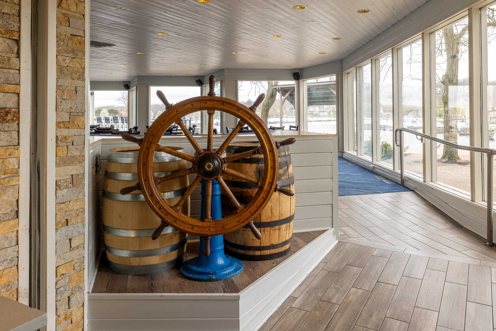 Vintage ship wheel display at the entrance