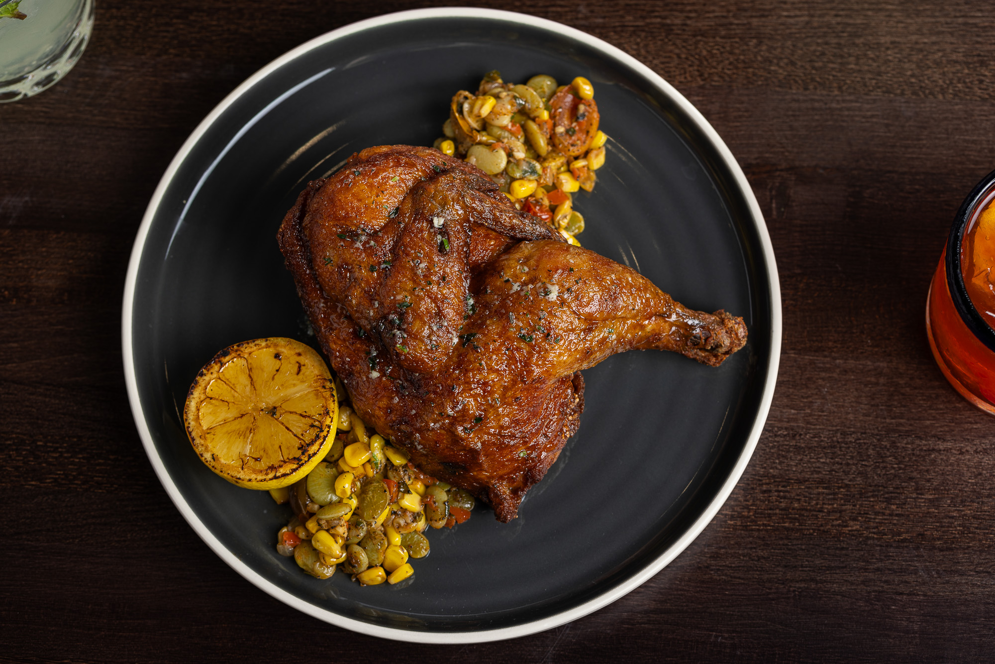 Half roast chicken with succotash and grilled lemon